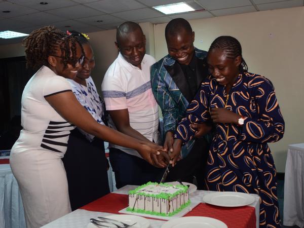 Members cutting the cake at YPF Dinner (2024 Edition)
